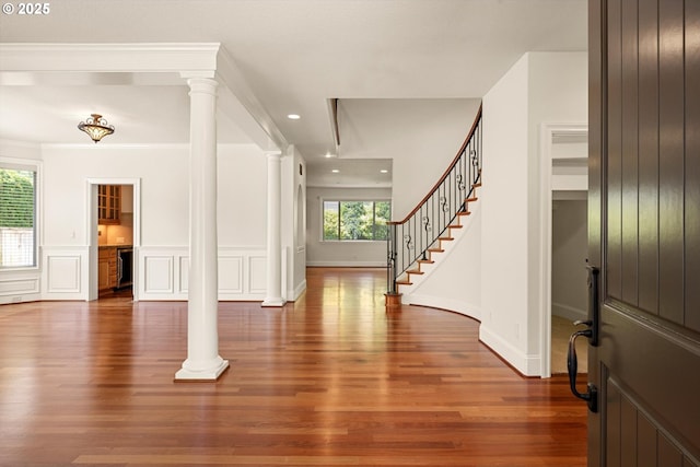 4123 Chad Dr, Lake Oswego, OR 97034 - foyer entrance featuring wood finished floors, ornate columns, stairs, recessed lighting, and a decorative wall