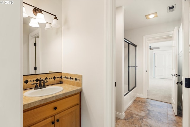 4123 Chad Dr, Lake Oswego, OR 97034 - bathroom featuring vanity, baseboards, shower / bath combination with glass door, and tasteful backsplash
