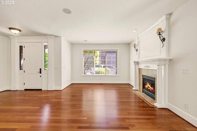 4123 Chad Dr, Lake Oswego, OR 97034 - entryway with a fireplace, wood finished floors, baseboards, and recessed lighting