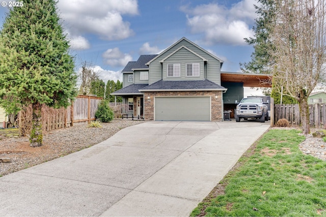 view of front of house featuring a garage, a shingled roof, concrete driveway, and fence