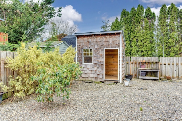 view of shed with fence