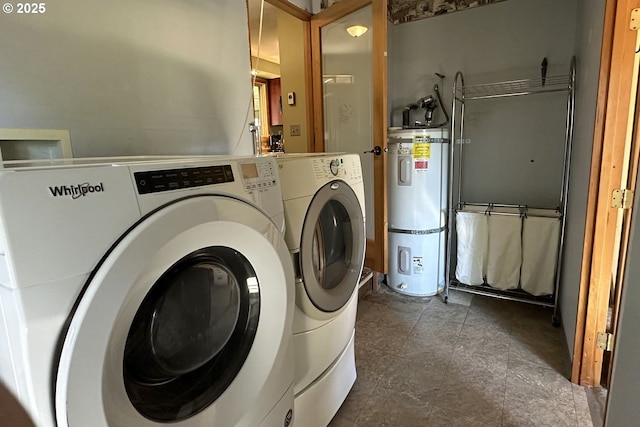 laundry area with water heater and separate washer and dryer