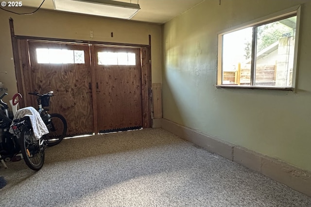 view of carpeted entrance foyer