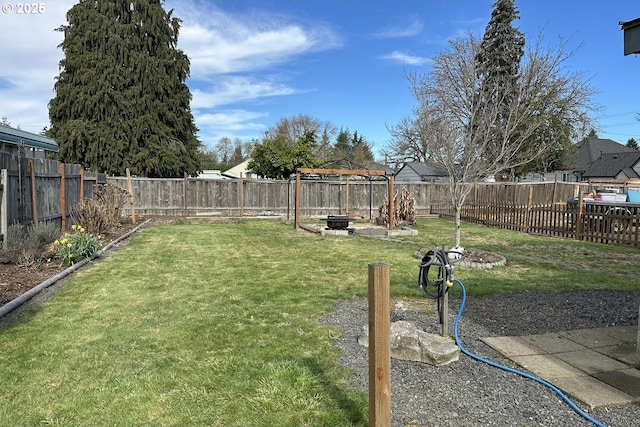 view of yard with a fire pit