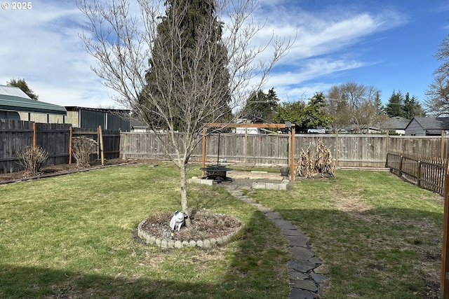 view of yard with an outdoor fire pit
