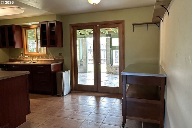 kitchen with french doors, a sink, and healthy amount of natural light
