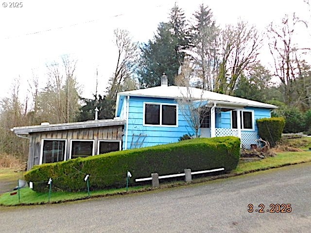 view of front of home featuring a chimney