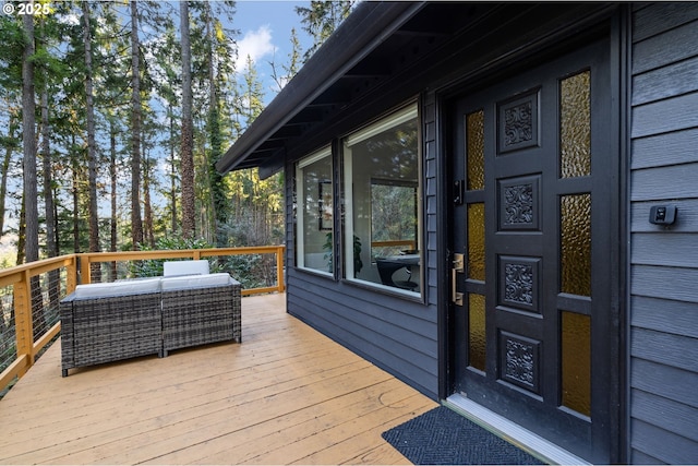 wooden deck with outdoor lounge area