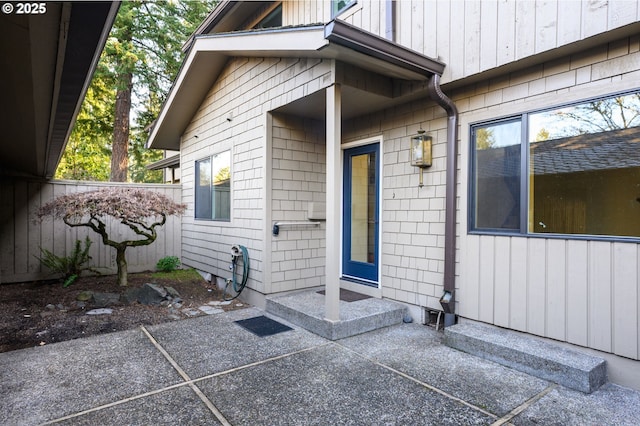 entrance to property featuring a patio