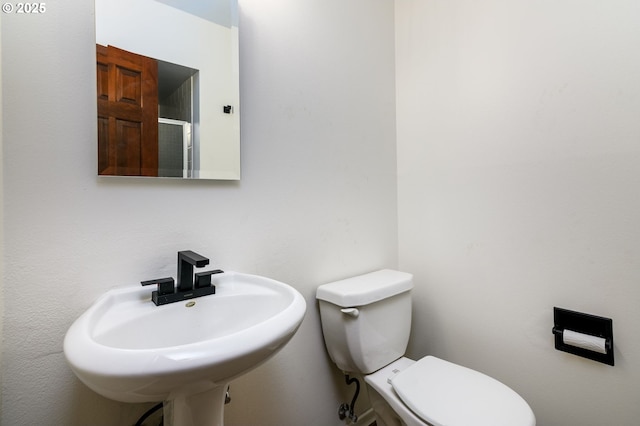 bathroom with sink and toilet