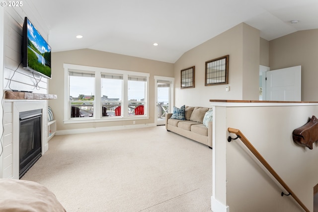 2539 SW Coral Loop, Lincoln City, OR 97367 - living room with vaulted ceiling, carpet flooring, a large fireplace, and recessed lighting