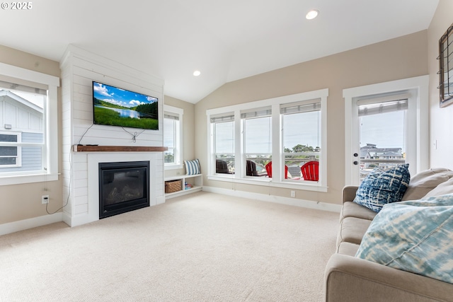 2539 SW Coral Loop, Lincoln City, OR 97367 - carpeted living area featuring a fireplace, recessed lighting, and lofted ceiling