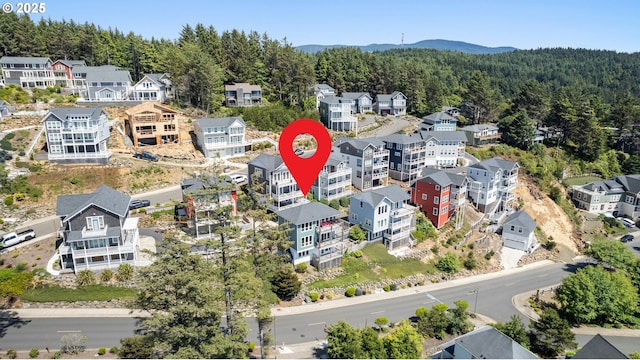 2539 SW Coral Loop, Lincoln City, OR 97367 - bird's eye view of a heavily wooded area and mountains