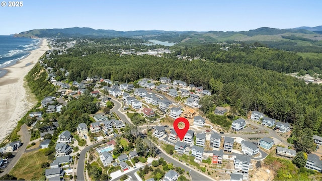 2539 SW Coral Loop, Lincoln City, OR 97367 - aerial view of property and surrounding area featuring a water and mountain view and a forest