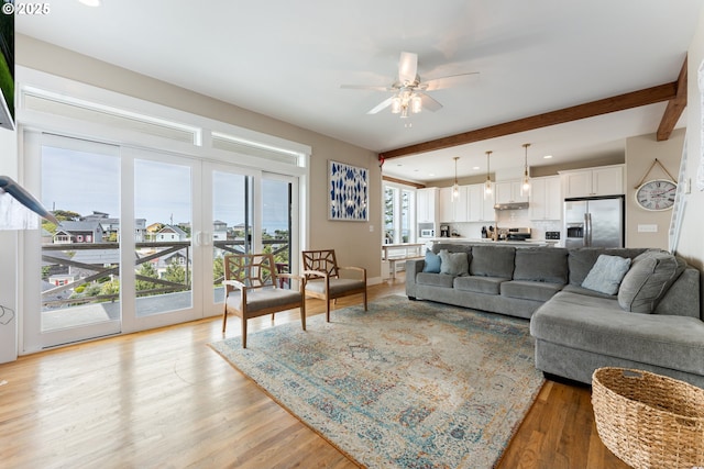 2539 SW Coral Loop, Lincoln City, OR 97367 - living room featuring a ceiling fan, light wood-style floors, beam ceiling, and recessed lighting