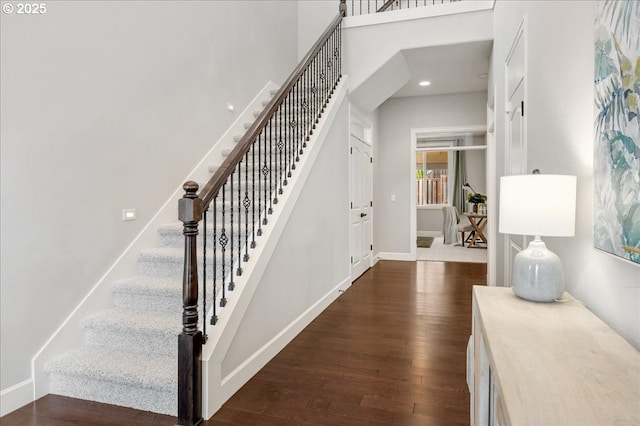 foyer entrance with dark hardwood / wood-style flooring