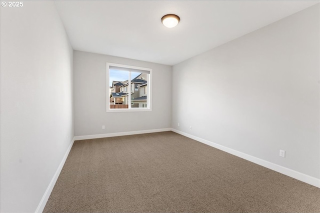 spare room featuring carpet flooring