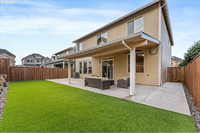 back of property featuring central air condition unit, a patio area, an outdoor living space, and a yard