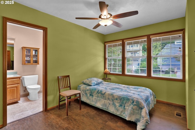 bedroom with connected bathroom, a ceiling fan, baseboards, and visible vents