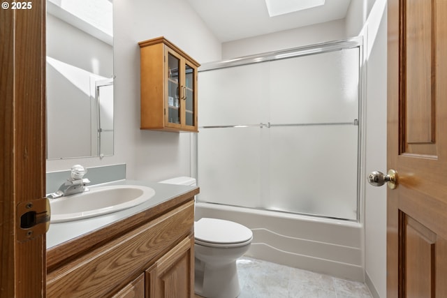 3023 Ashley Loop, Eugene, OR 97405 - full bathroom with a skylight, toilet, vanity, bath / shower combo with glass door, and tile patterned flooring