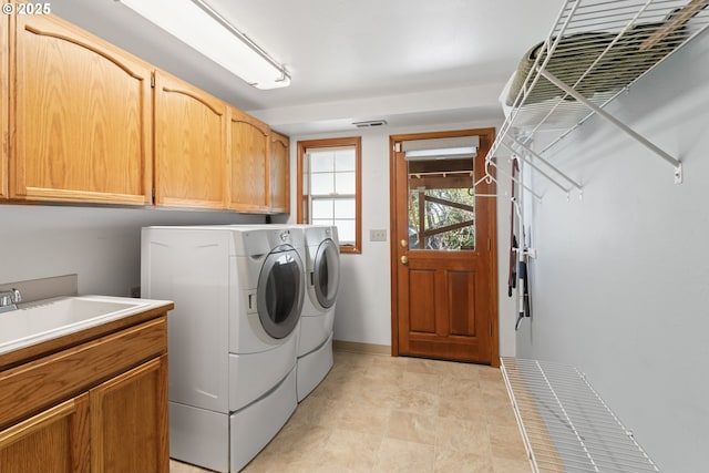 laundry room featuring baseboards, cabinet space, independent washer and dryer, and visible vents