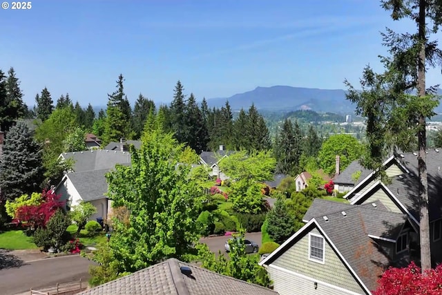 birds eye view of property with a residential view and a mountain view
