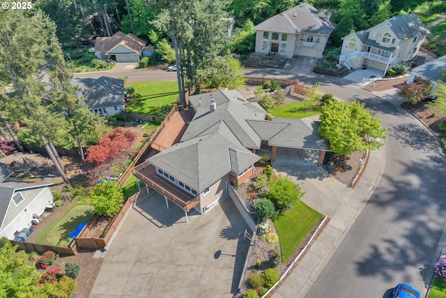 birds eye view of property with a residential view