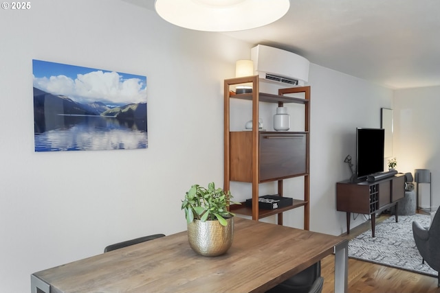 109 NE Shaver Ave, Portland, OR 97212 - dining area featuring an AC wall unit and wood finished floors