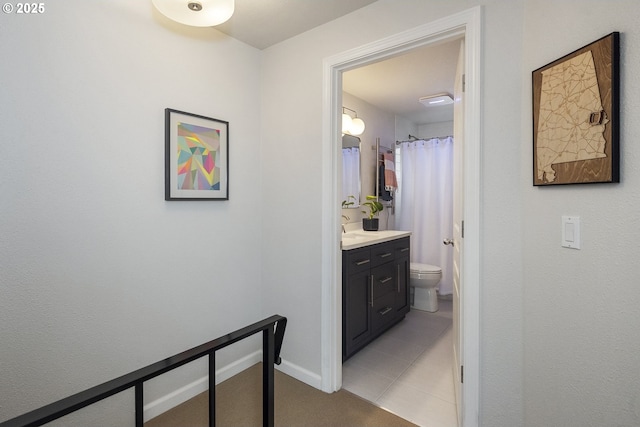 109 NE Shaver Ave, Portland, OR 97212 - hall featuring baseboards, light tile patterned floors, and a sink