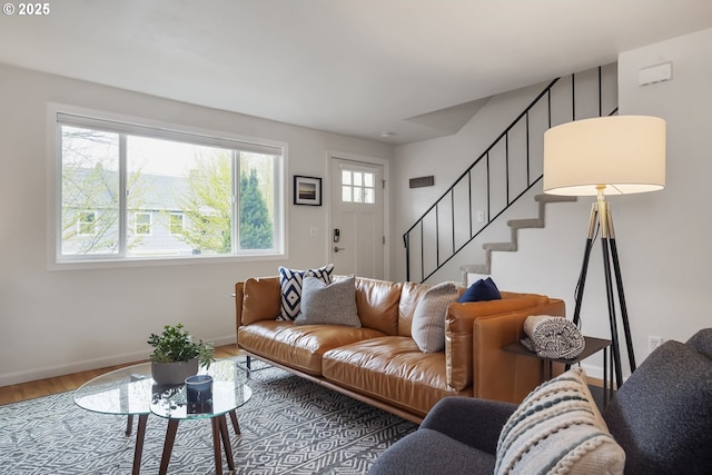 109 NE Shaver Ave, Portland, OR 97212 - living room featuring wood finished floors, stairs, and baseboards