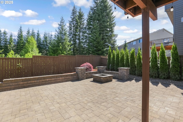 17067 NW Catalpa St, Portland, OR 97229 - view of patio / terrace with fence and a fire pit
