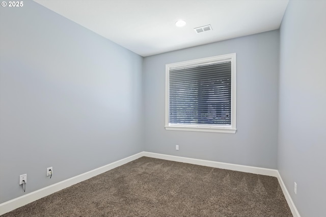 17067 NW Catalpa St, Portland, OR 97229 - empty room with dark colored carpet, baseboards, and recessed lighting