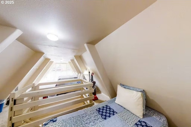 bedroom featuring lofted ceiling