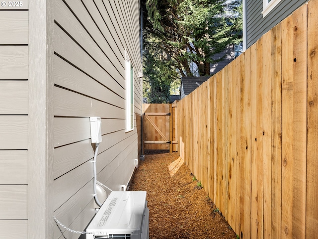 688 SE 47th Ave, Portland, OR 97215 - view of side of home with a garage, ac unit, and fence