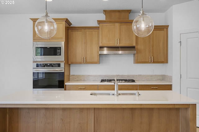 2930 S Cherry Grove Way, Ridgefield, WA 98642 - kitchen with light countertops, hanging light fixtures, stainless steel appliances, and under cabinet range hood