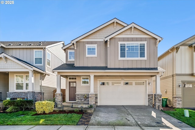 craftsman inspired home featuring driveway, a garage, stone siding, roof with shingles, and board and batten siding