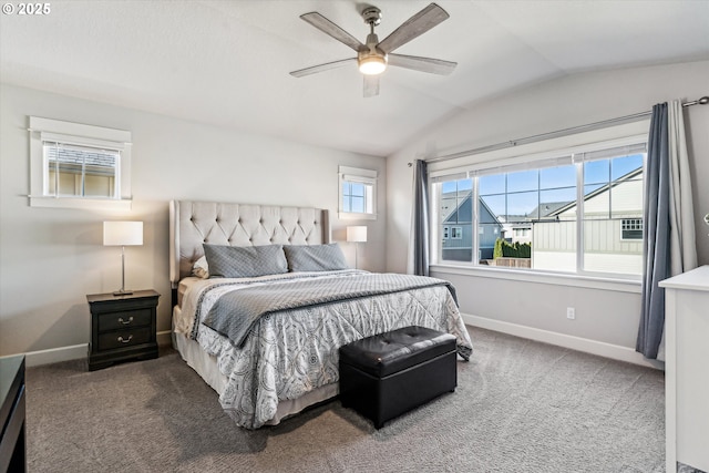 bedroom with vaulted ceiling, carpet flooring, and baseboards