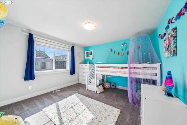 bedroom with carpet, visible vents, and baseboards