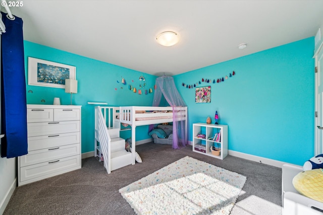 bedroom with carpet and baseboards