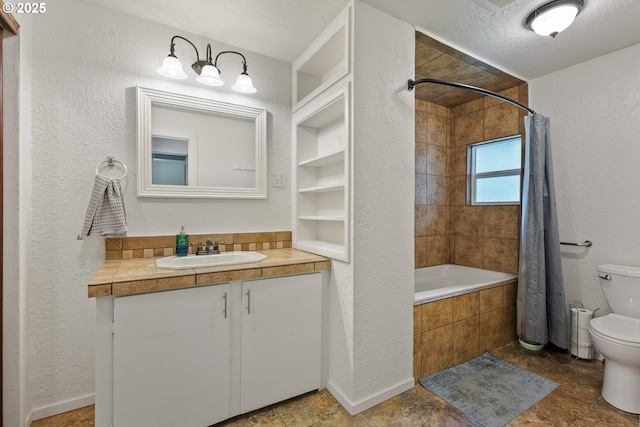 full bath featuring toilet, tiled shower / bath combo, a textured wall, and vanity