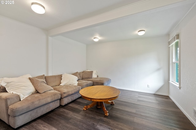 living room with dark wood-style floors, ornamental molding, and baseboards