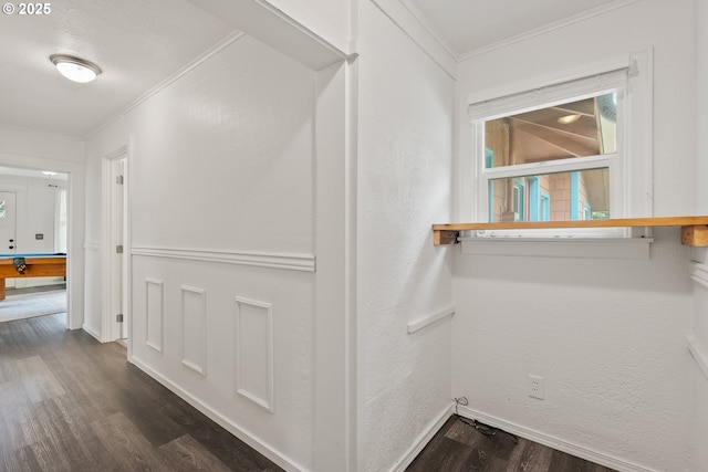 walk in closet with dark wood-type flooring and billiards
