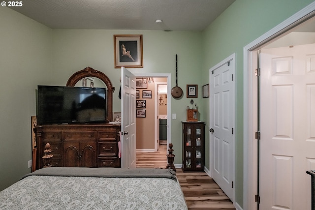 bedroom with light hardwood / wood-style flooring