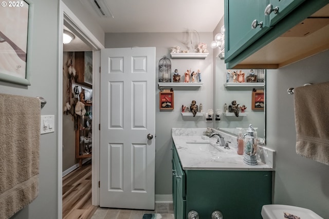 bathroom with vanity and wood-type flooring