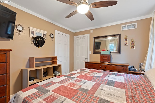 bedroom featuring crown molding and ceiling fan