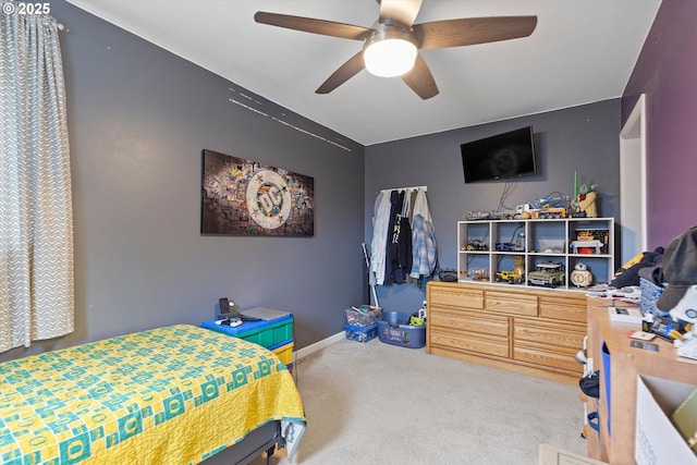 bedroom featuring carpet floors, ceiling fan, and a closet