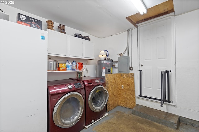 clothes washing area featuring electric water heater, washer and clothes dryer, electric panel, and cabinets