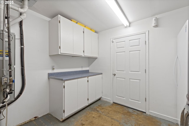 laundry room with cabinets