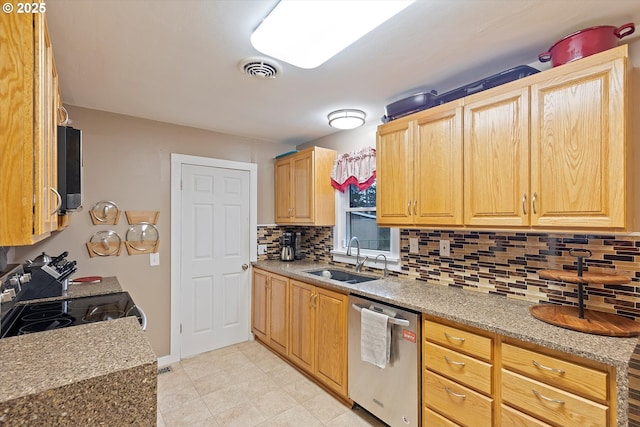 kitchen with tasteful backsplash, appliances with stainless steel finishes, and sink