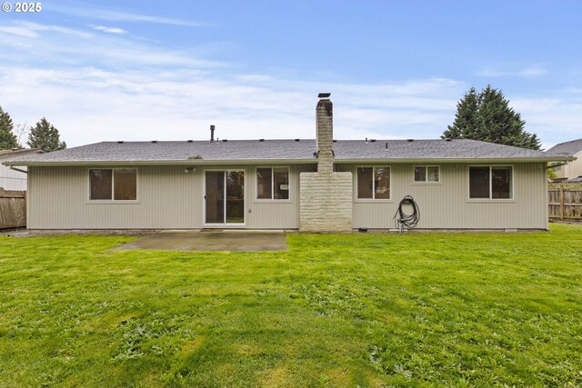 6253 SW 204th Pl, Beaverton, OR 97078 - back of house featuring a fenced backyard, a patio area, and a chimney